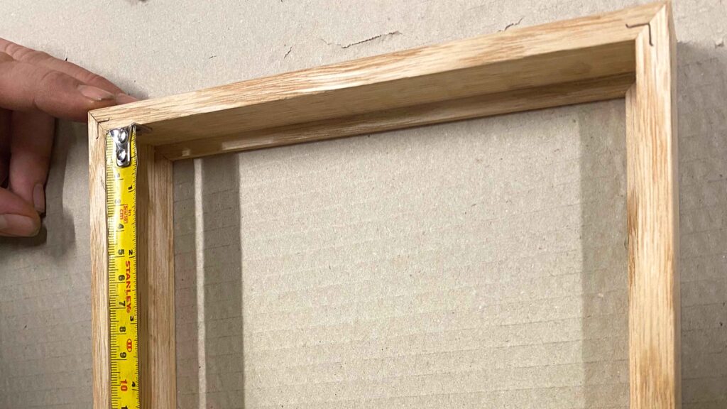 measuring a wooden frame