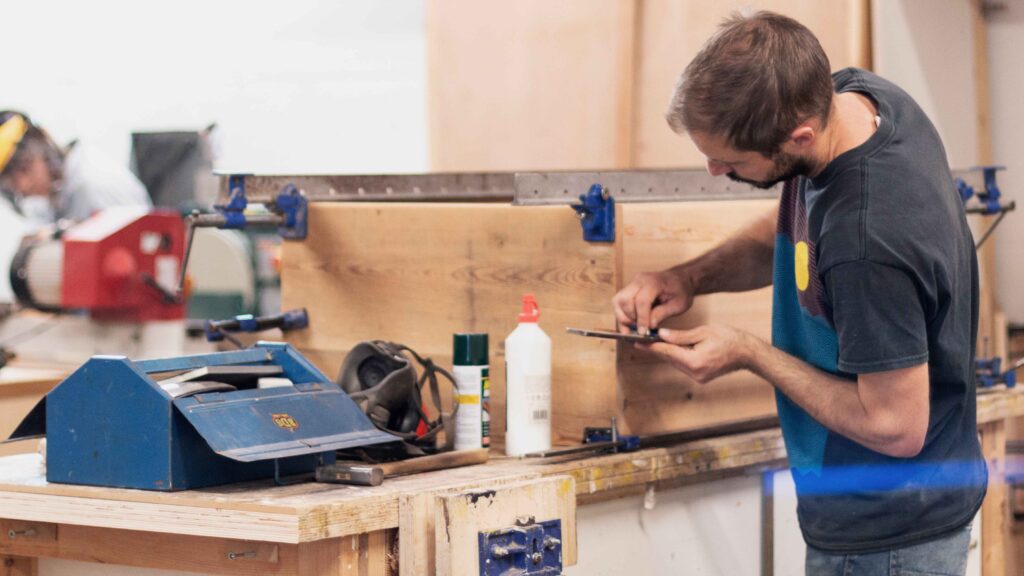 adult making wooden storage