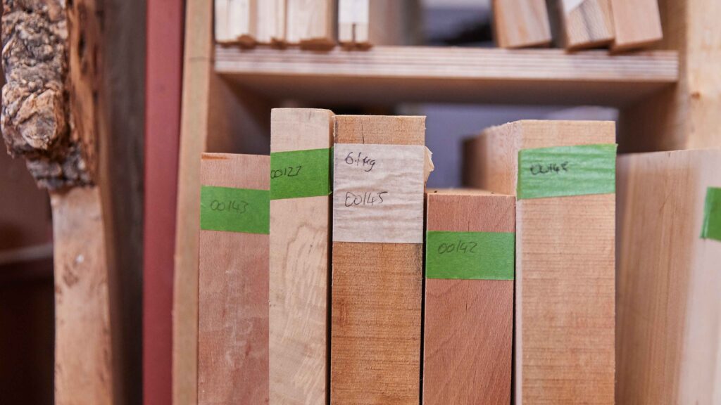 different types of wood stacked on shelf