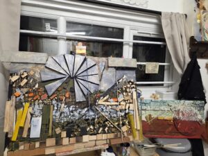 a art piece made of woood, cut in to segments with painted illustrations and depth